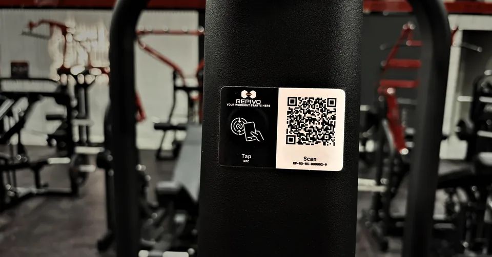 A REPIVO Tag mounted on a machine: the black half for NFC, the white half with a QR code.